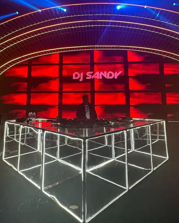 My illuminated DJ console at a grand wedding reception in Vietnam. The setup is a key part of the experience, and I ensure it looks as good as it sounds.