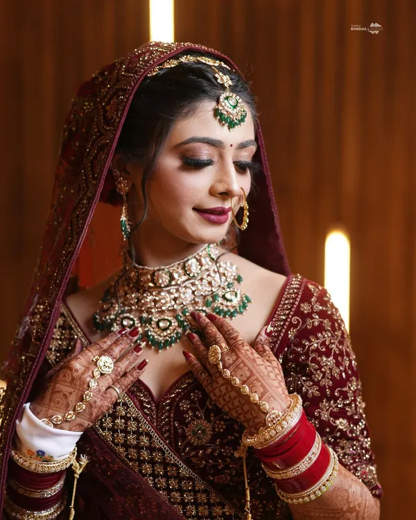 A radiant bride, her beauty enhanced by exquisite jewelry and a confident smile. I focus on capturing the details, from the intricate necklace to the sparkle in her eyes.
