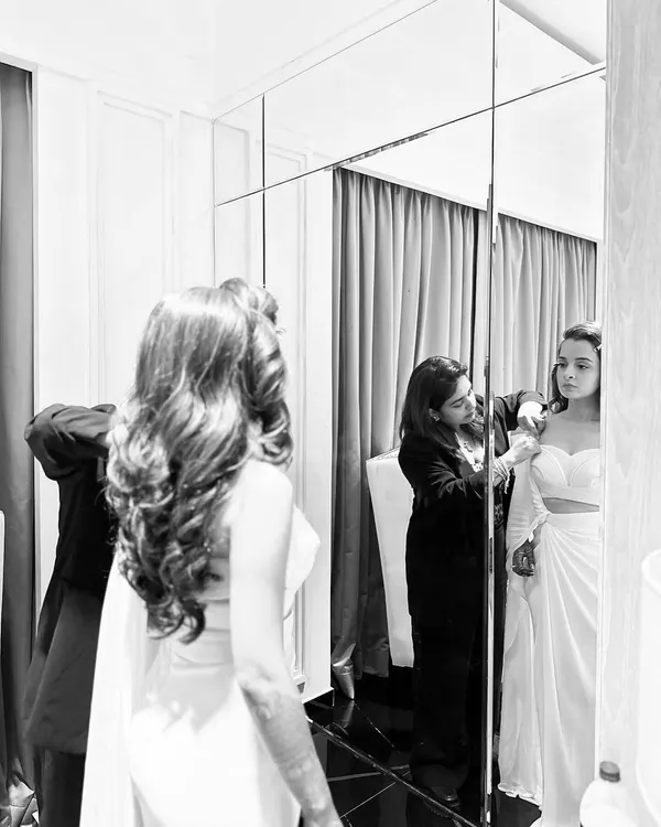 The styling journey in action. Here I am during a fitting with the bride, Aashvi, making sure every detail of her Amit Aggarwal gown is absolutely perfect. This collaborative process is my favorite part.
