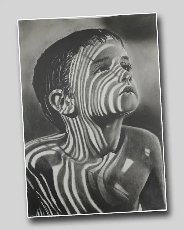 This realistic pencil portrait by Ayush Agnihotri uses the interplay of light and shadow to create a striking effect. The zebra-like stripes on the child's face produce a captivating and thought-provoking image.