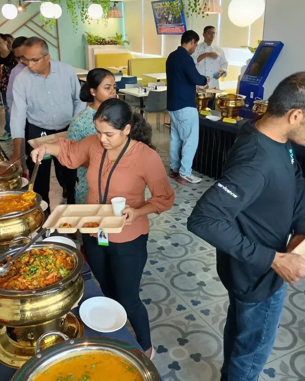 A glimpse into a bustling corporate lunch we catered. We focus on creating a vibrant and enjoyable dining experience that brings employees together over great food.