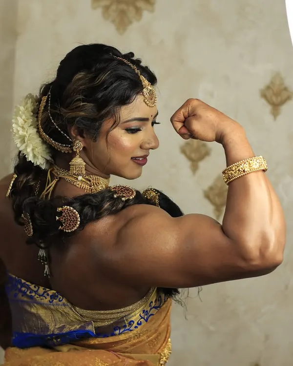 This is the essence of my philosophy: strength is beauty. Dressed in traditional attire, this pose captures the powerful physique built through years of dedication, proving you can be both a beast in the gym and graceful in life.