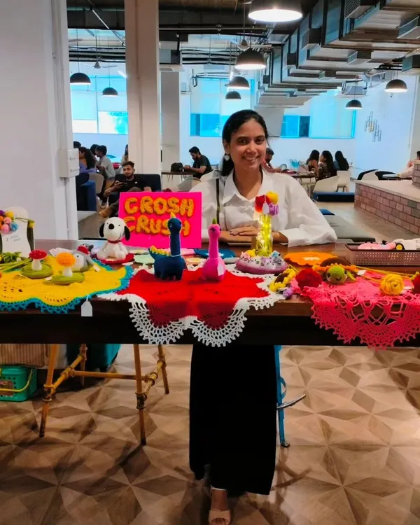 A photo of me at my very first exhibition. It was a huge milestone, and I was so excited to share my handmade creations with everyone.