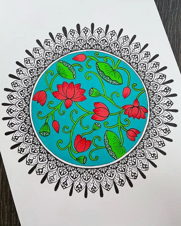 A beautiful fusion of Pichwai art and mandala design. The center of this piece features a vibrant, traditional Pichwai-style lotus painting, which is then framed by a classic black and white mandala border.