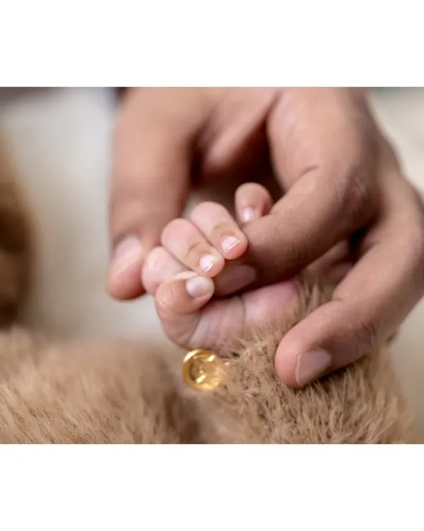 This is the moment that says it all. A tiny hand holding on tight, a symbol of the new, unbreakable bond your family shares. I focus on capturing these quiet, heartfelt connections that you will treasure for a lifetime.