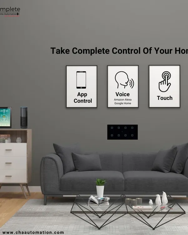 We put complete control of your home in your hands. This living room setup demonstrates the three primary ways you can interact with your smart home: through a dedicated app, voice commands via assistants like Alexa and Google Home, and elegant, responsive touch panels.
