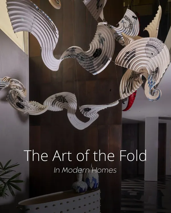 This installation, created with artist Ankon Mitra, showcases how traditional fold-based techniques can elevate a space. Here, a cascading origami-inspired light made from parchment floats through a triple-height atrium, introducing softness and movement.