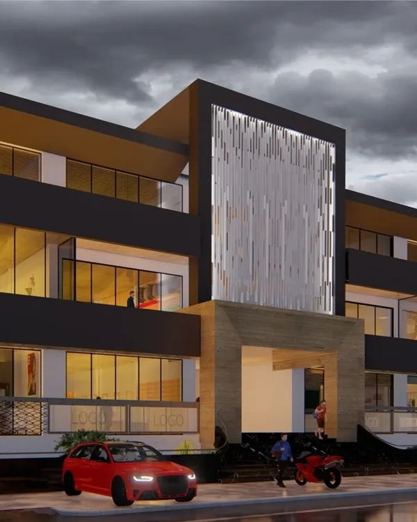 A dramatic evening render of a proposed commercial building. The design features a prominent illuminated facade, extensive use of glass, and a bold, contemporary form to create a landmark structure.