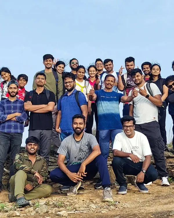 This is what it's all about. A team, energized and connected, taking in the view from the top after a rewarding trek. I help companies trade conference rooms for these unforgettable moments of shared achievement.