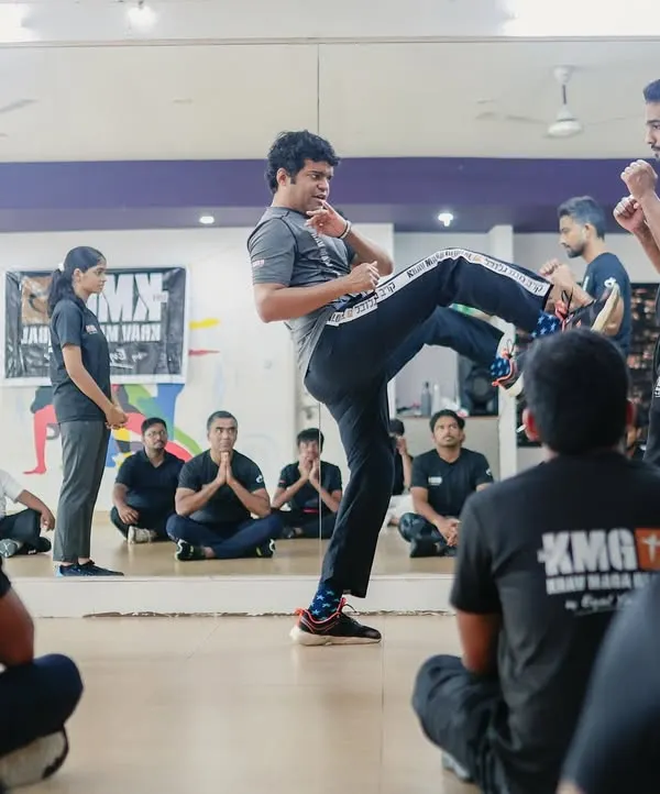 A demonstration during our Third-Party Protection Seminar in Mangalore. An instructor shows how to use combatives to intercept a threat and create a safe zone for another person.
