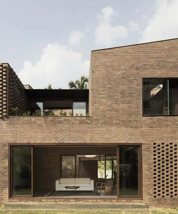 Our first house, a fully load-bearing brick construction in Bangalore. We embraced the challenge of this technique to create a home with rich texture and a monolithic presence, featuring brick jaali screens for natural ventilation.