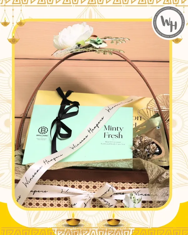 This Diwali hamper, a collaboration with skincare brand Brillare, is presented in a beautiful cane basket. It features their "Minty Fresh" product, elegantly tied with a custom branded ribbon from Winsome Hampers.
