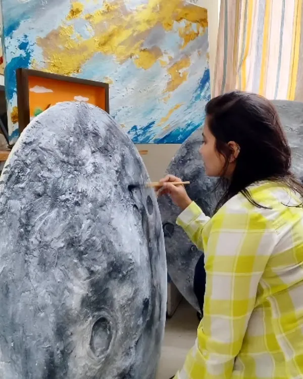 Here I am in my happy place, adding details to a new moon art piece. Capturing the magic of the moon is a creative journey I deeply enjoy, one brushstroke at a time.