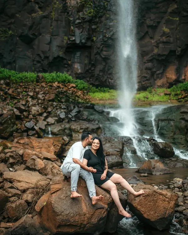 A romantic pre-wedding moment captured against a stunning waterfall backdrop. I specialize in finding dramatic natural landscapes that add a sense of adventure and beauty to your couple photoshoot.
