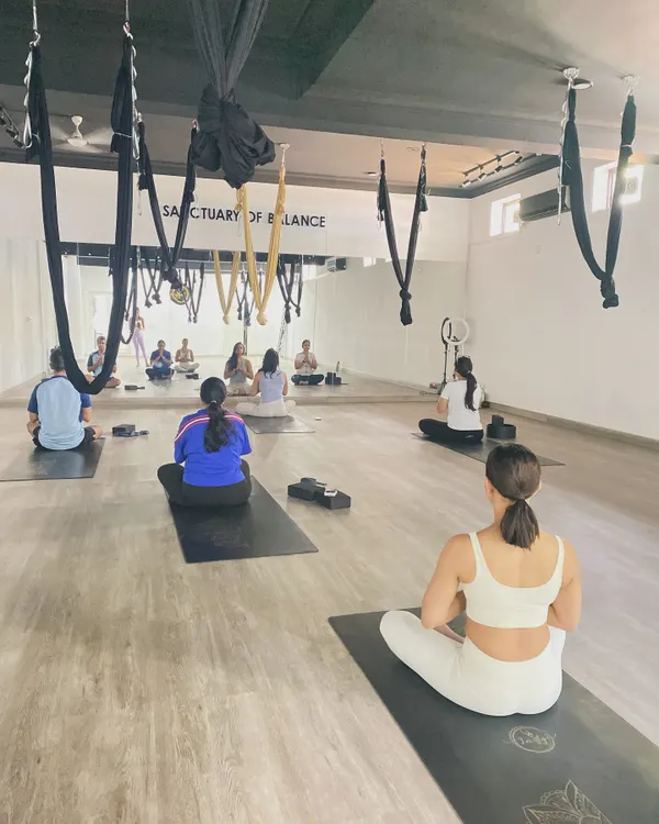 A moment of shared stillness before class begins. This collective energy sets the tone for our practice, creating a focused and peaceful environment for everyone on the mat.