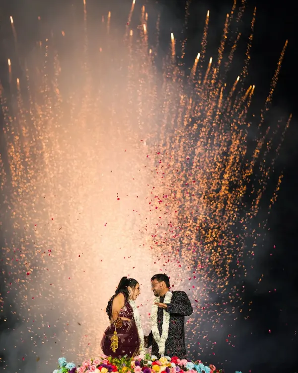 In a sky bursting with light, two hearts found their forever. We believe in capturing these grand, cinematic moments that feel like they are straight out of a movie, because your love story deserves nothing less.