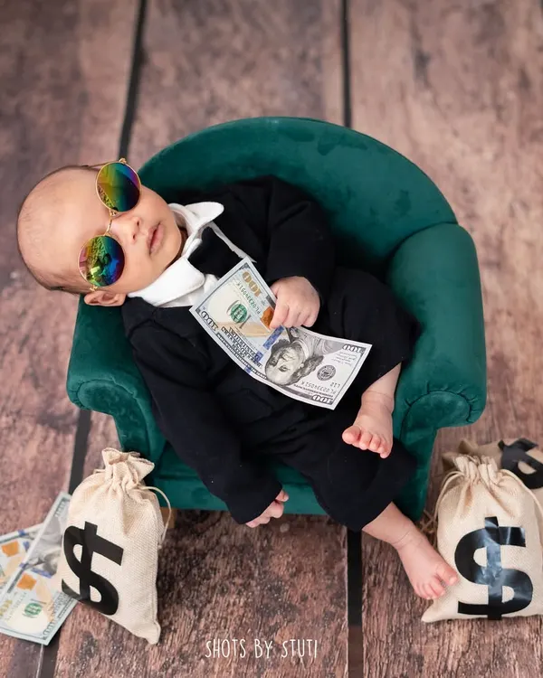 Introducing the real Boss Baby. This little guy is already in charge. Themed shoots like this are a fun way to add humor and personality to your newborn gallery. All poses are done with the utmost safety and support for the baby.