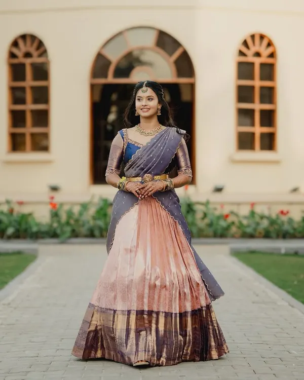 The grace of a traditional langa voni is unmatched. My beautiful bride Brunda looks radiant in this custom-made piece, created by upcycling a classic silk saree.