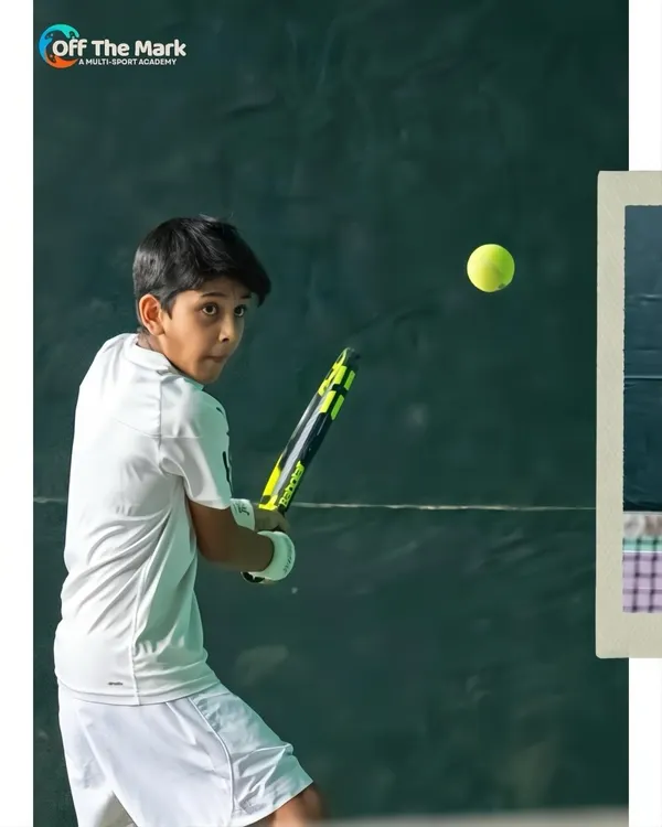Every rally is a lesson in focus and determination. Here, a young player at our tennis academy keeps his eye on the ball, ready for the return shot.