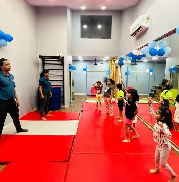 An instructor leads a group of young dancers at our Gorai center. This image shows a typical class setup where students have ample space to move and learn choreography in a structured, interactive setting.
