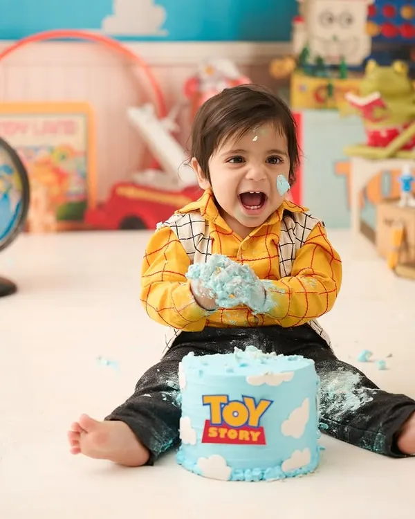 A "Toy Story" themed cake smash for a little fan. We love incorporating your child's favorite characters and stories into our first birthday photography sessions.