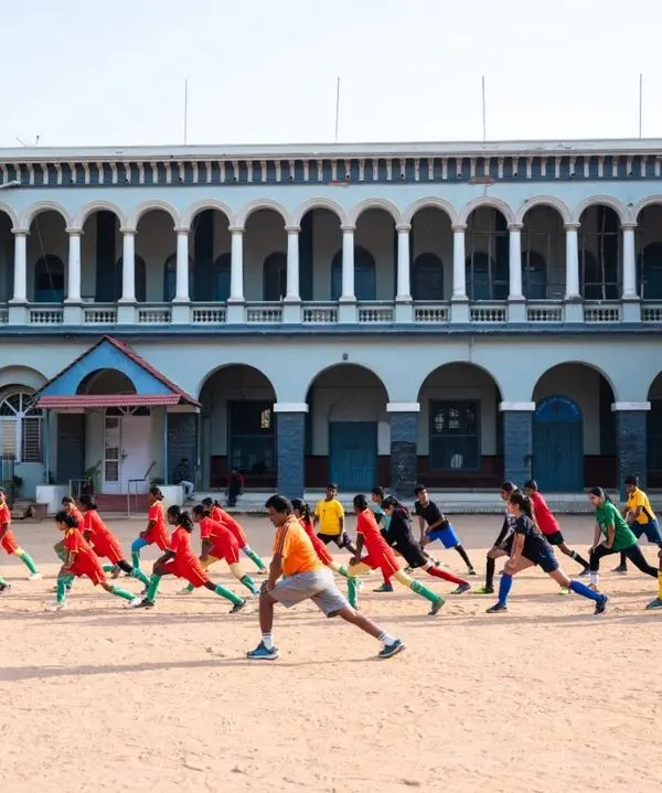 A group of young players doing warm-up lunges at our 2023 summer camp, held at the historic St. Germain Academy. Discipline and preparation are the first lessons of the day.