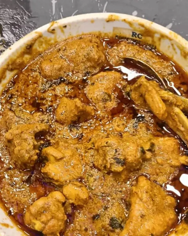 A bowl of my special chicken korma, with a rich, oily gravy and tender pieces of meat. This is pure comfort food.