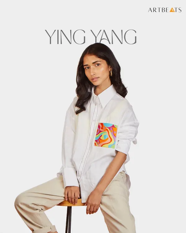 The Ying Yang oversized hemp shirt. This piece is light, soft, and features a pocket with my swirling, colorful artwork, bringing a sense of balance and artistic flair to a classic boyfriend-fit shirt.