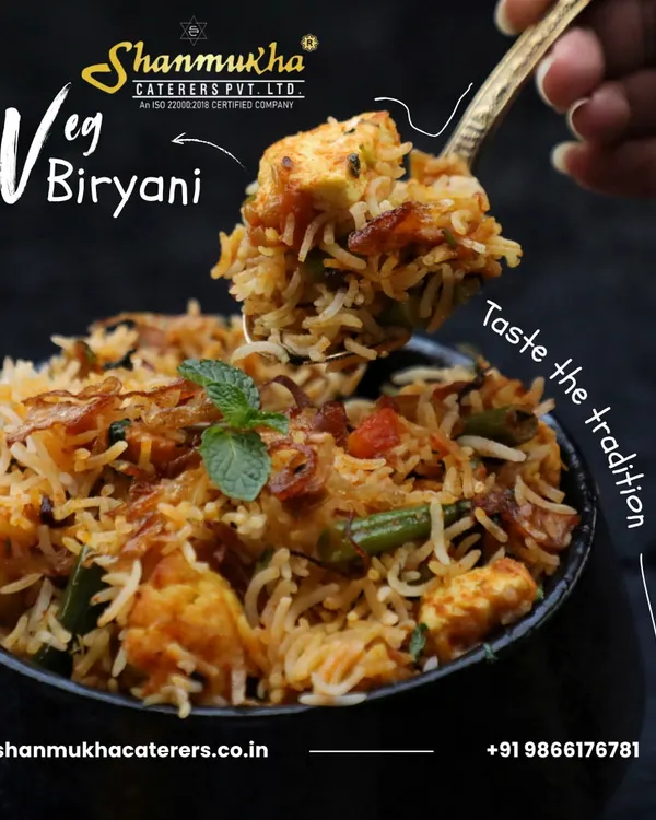 A spoonful of our delicious Veg Biryani, showcasing the perfectly cooked basmati rice, fried onions, fresh vegetables, and paneer. Taste the tradition in every bite.