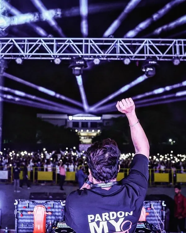This is the moment. Me, the music, and a sea of lights in front of me at a college fest in Kolhapur. I don't just play for a crowd, I become one with it. This is the spiritual experience I sell.