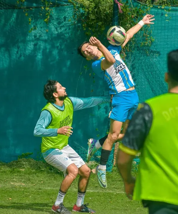 This is the moment it all comes down to. A player leaps for a header during a competitive match, showcasing the athleticism and passion you'll find on our grounds. We provide the professional turf and atmosphere for players to create unforgettable highlights.