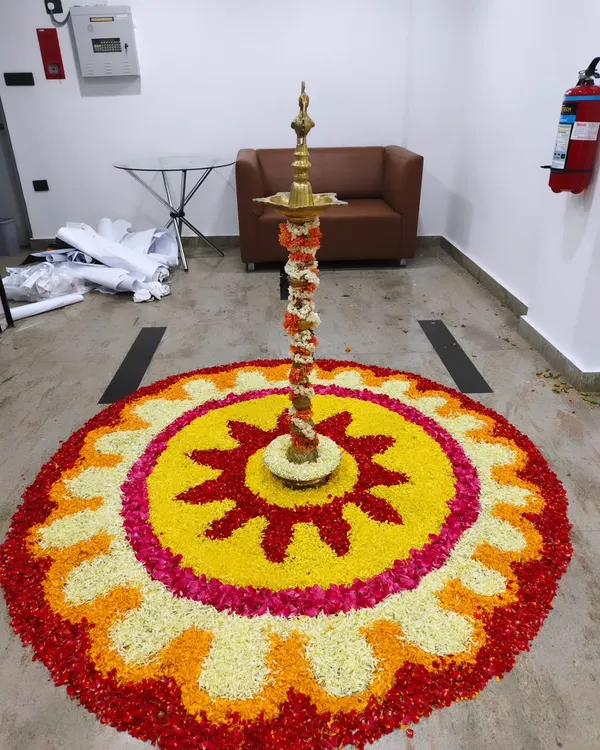 I blend tradition with modern corporate style. This intricate flower petal rangoli with a traditional brass lamp (Diya) at its center brought an auspicious and beautiful touch to the Trans cosmos office opening.