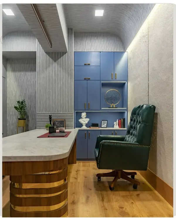 The director's cabin from a recent office project. I designed this space to be authoritative yet comfortable, with a custom desk, a classic leather chair, and a mix of modern and textured wall finishes.