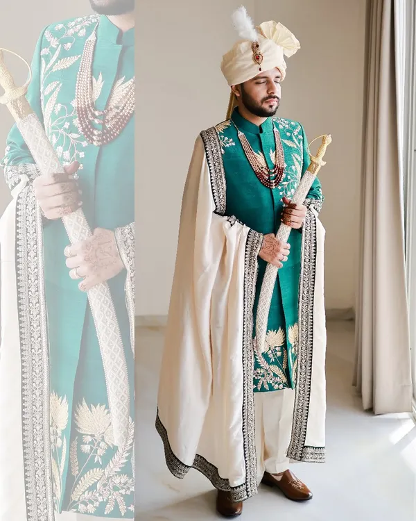 We believe a groom's attire should be as monumental as the occasion. This bespoke teal sherwani, rich with intricate embroidery and paired with a regal shawl and turban, is crafted for the man who is the center of the celebration. 👑