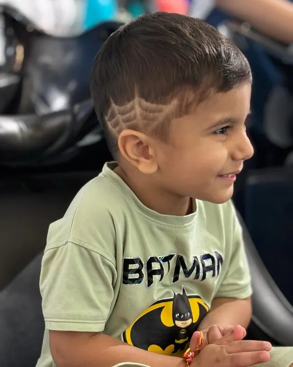 Who needs a superhero mask when you can have a spider-web haircut? I love creating fun designs like this to make haircuts an exciting experience for my youngest clients.