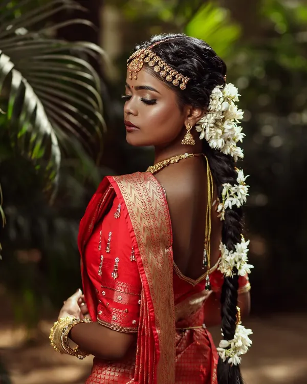 A powerful and artistic portrait of a South Indian bride. This look celebrates deep skin tones, using a dewy base and defined features to create a truly stunning result.