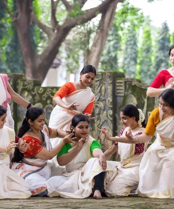 This is the heart of our collective. A candid moment of shared joy and learning from our 'Upaasanaa' workshop. It captures the spirit of togetherness and the beauty of Mohiniyattam that we strive to nurture in our *kalari*.
