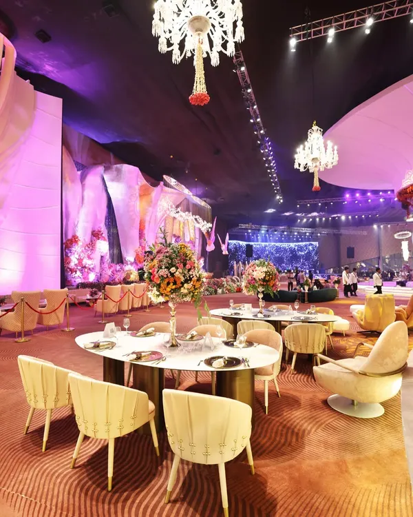 A glimpse of a luxurious corporate soiree we catered. The seating, the lighting, and the stage are all part of the grand experience we help create, where the menu is designed to be the highlight of the evening.