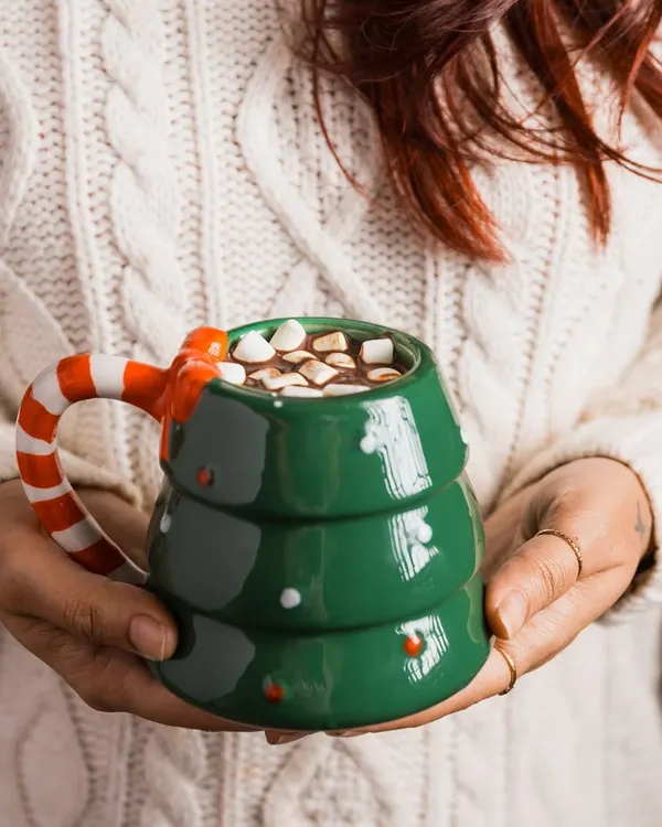 We didn’t just shoot a mug; we captured the essence of Christmas. This shot of a festive tree-shaped mug filled with hot chocolate and marshmallows is all about creating that cozy, holiday feeling.