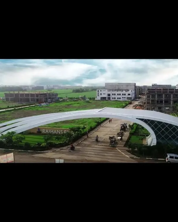 The entrance gate for the Rajhans Elysian township is designed as a modern, sculptural arch. Its sweeping form creates a memorable and futuristic sense of arrival for residents and visitors.