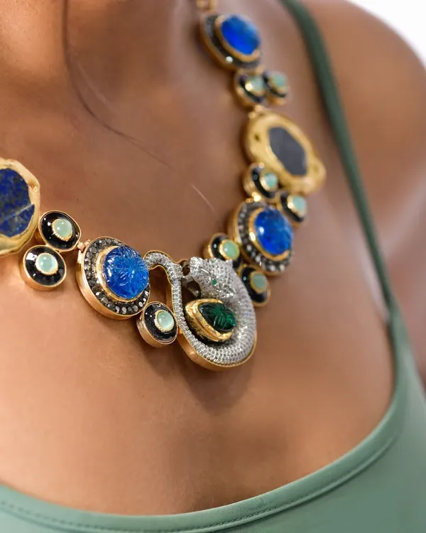 A detailed macro shot is essential for jewelry photography. Here, the focus is entirely on the stunning craftsmanship of the necklace, capturing the sparkle of the diamonds and the deep blue of the lapis lazuli stones. This is the kind of clean, crisp shot needed for product listings.