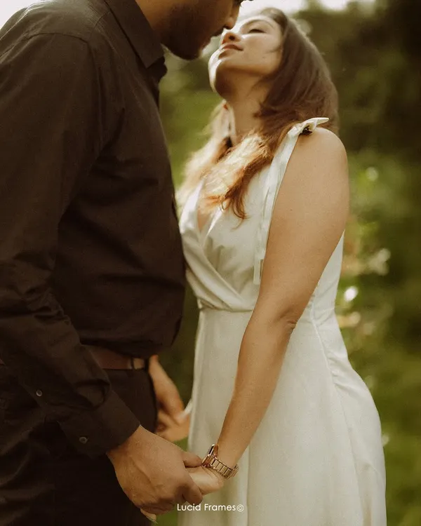A quiet moment of connection, just before a kiss. We believe the most powerful stories are often told in the softest whispers, using natural light to capture the warmth between two people.