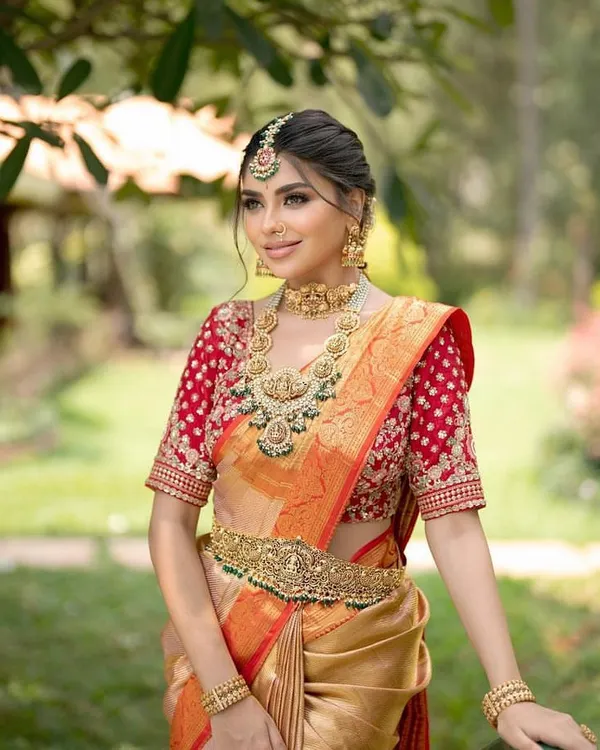 A classic South Indian muhurtham look. I focus on creating a timeless appearance, ensuring the Kanjivaram saree is draped perfectly to complement the temple jewelry and the bride's natural radiance.