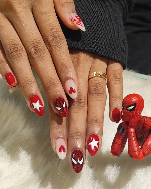 Your friendly neighborhood nail art. This custom set features hand-painted Spiderman masks, webs, and logos for a true Marvel fan. It’s proof that nail art is for everyone.