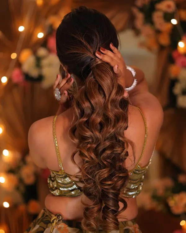 A fresh and peppy beach waves ponytail, perfect for a sangeet or cocktail look. We teach you how to create volume, texture, and hold for hairstyles that last all night long.