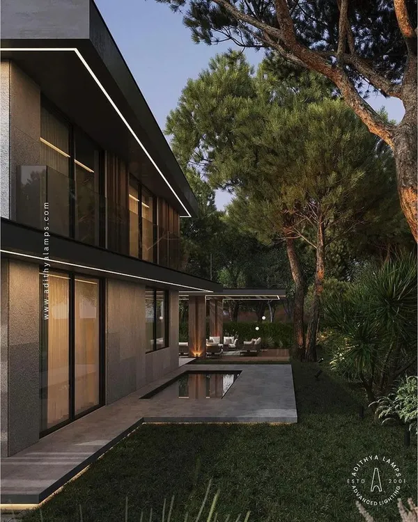 We used our weatherproof LED profile lights to trace the roofline of this modern home. This technique of architectural lighting highlights the building's geometry and creates a striking visual statement from a distance.