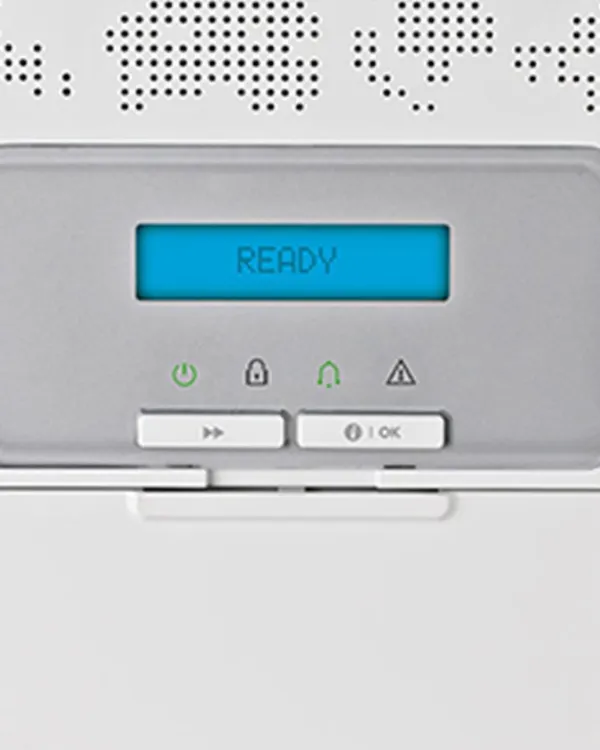 A close-up of a Visonic intrusion detection system panel, with the display screen showing a "READY" status. This indicates the system is armed and actively protecting your home with its advanced security features.