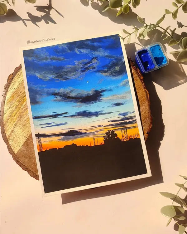 A custom A5 skyscape painting I completed for an order. The dramatic blue and orange sunset over the city silhouette was so much fun to create using gouache.