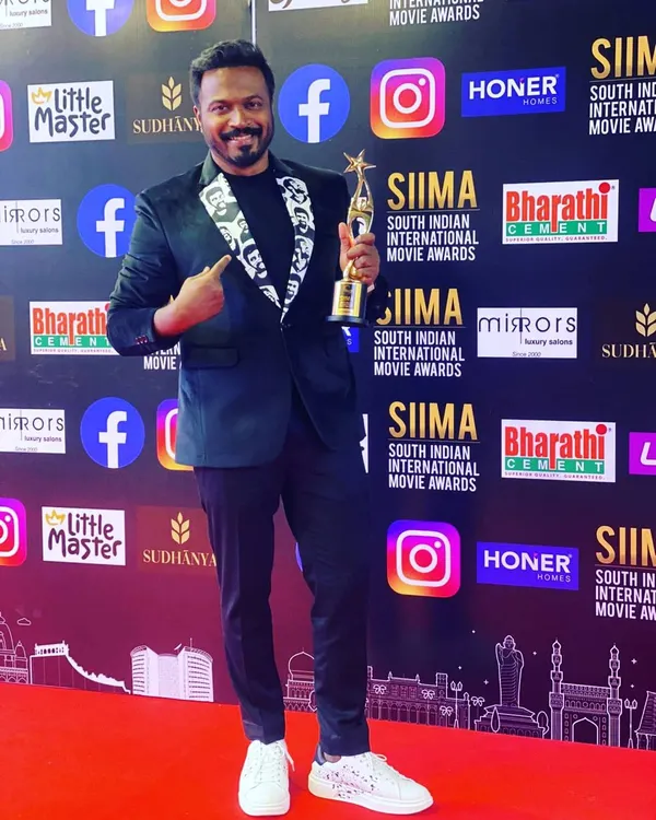 Director Pannaga Bharana on the red carpet at SIIMA 2021. I designed this blazer with a custom-printed lapel featuring the face of his dear friend Chiru, making it a deeply personal tribute.