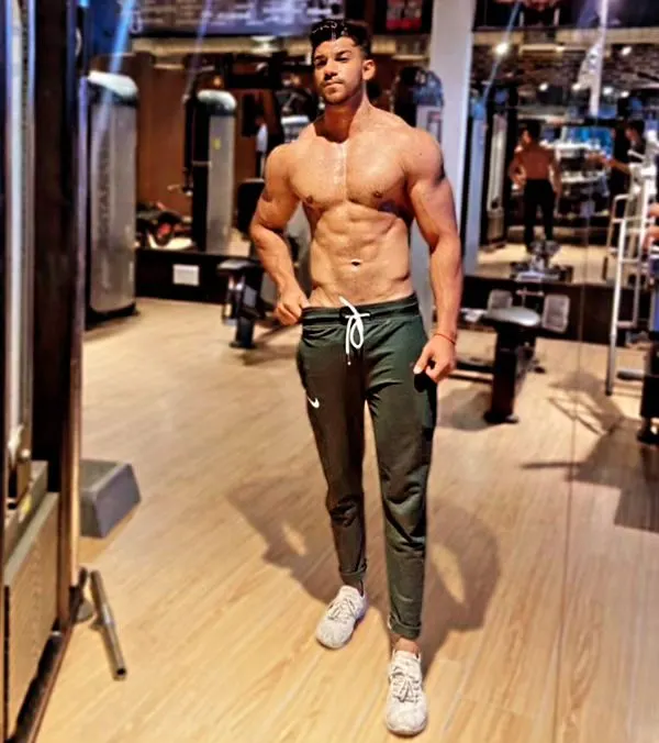 This is the level of conditioning we aim for. A lean midsection with visible abs and obliques is a sign of a disciplined diet and smart training, which are the cornerstones of my coaching philosophy.